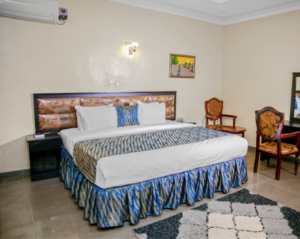 Comfortable guest room at Crown City Resort in Ogun State for corporate retreats and business stays.